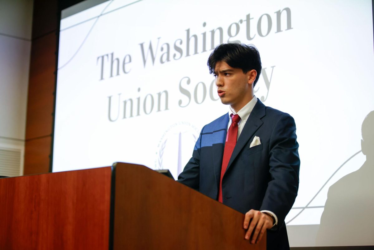 Washington Union Society Secretary Raymond Hennesey presents closing arguments during the debate.