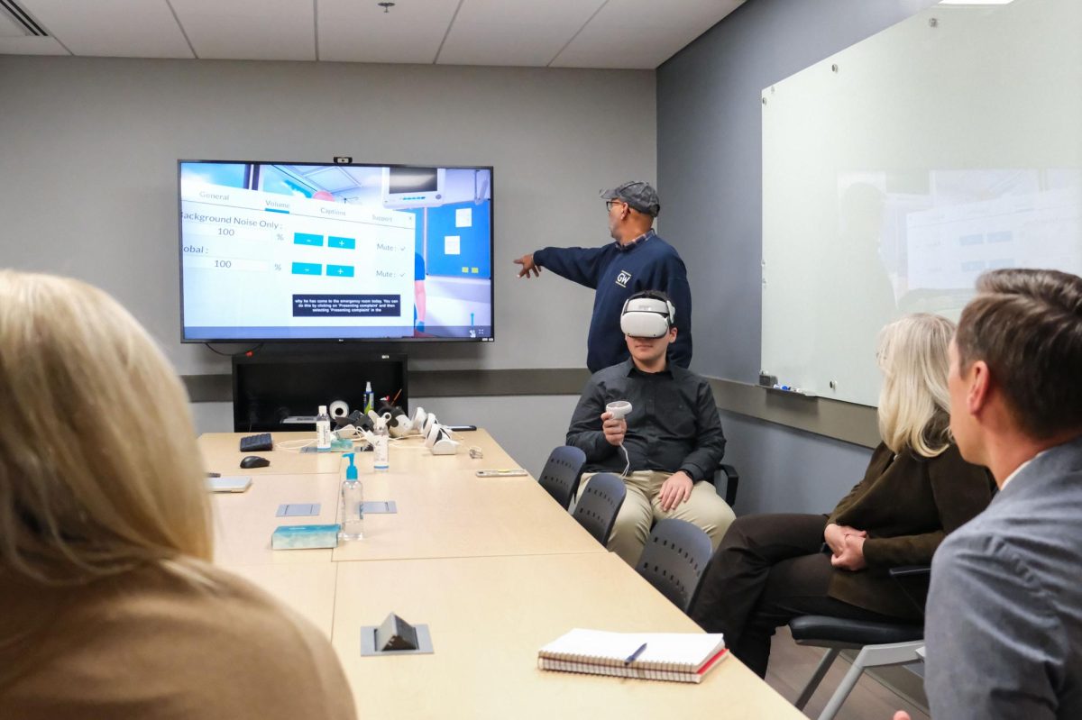 Assistant News Editor Tyler Iglesias tests out the virtual reality simulator at the Simulation and Innovation Learning Center.