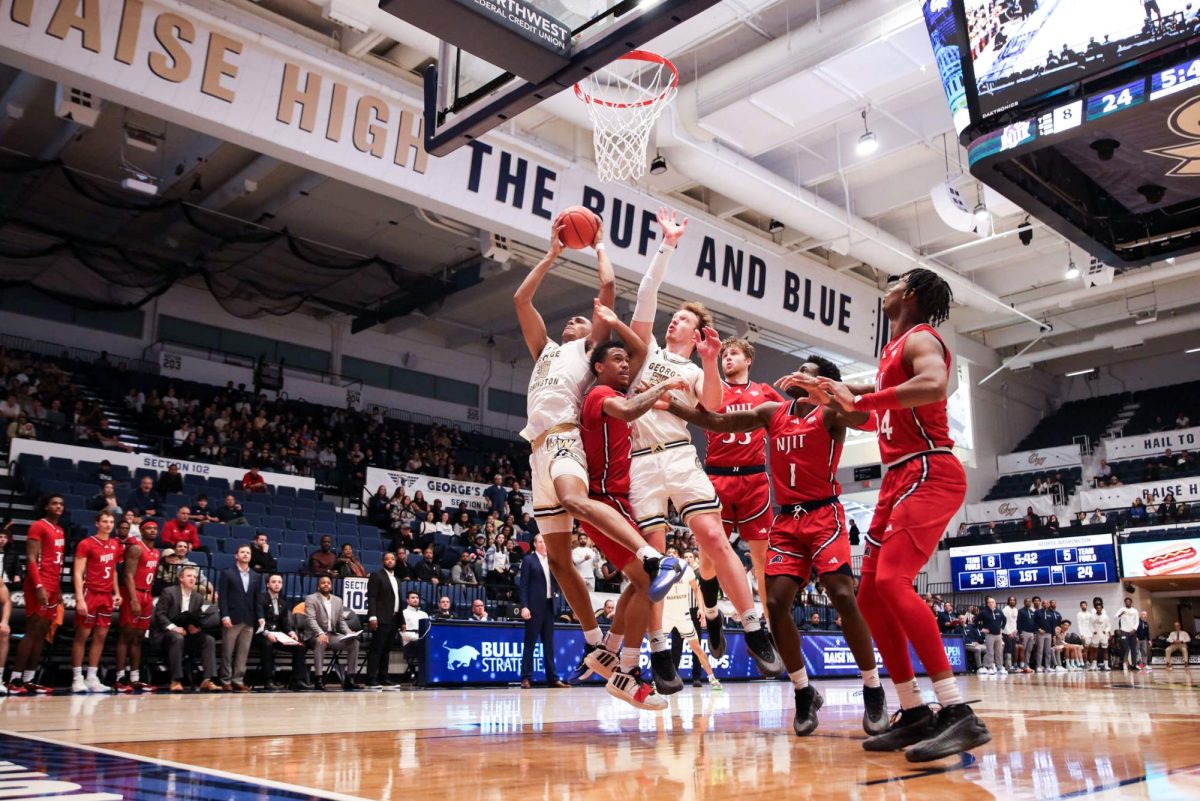 Redshirt junior forward Rafael Castro and Graduate forward Sean Hansen shoot a basket during a game against NJIT yesterday.