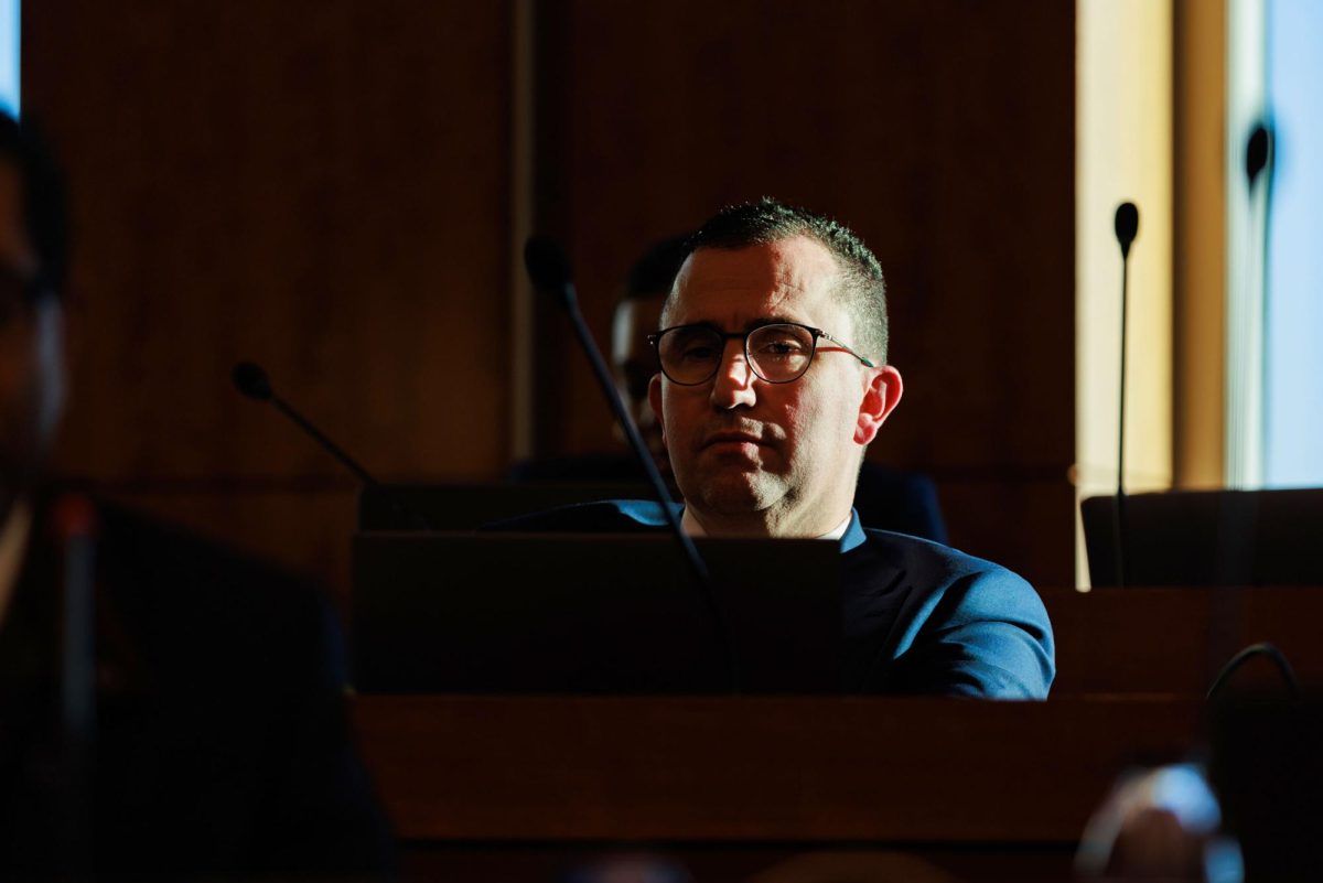 Chief Financial Officer Bruno Fernandes illuminated by sunlight at a November Faculty Senate meeting.