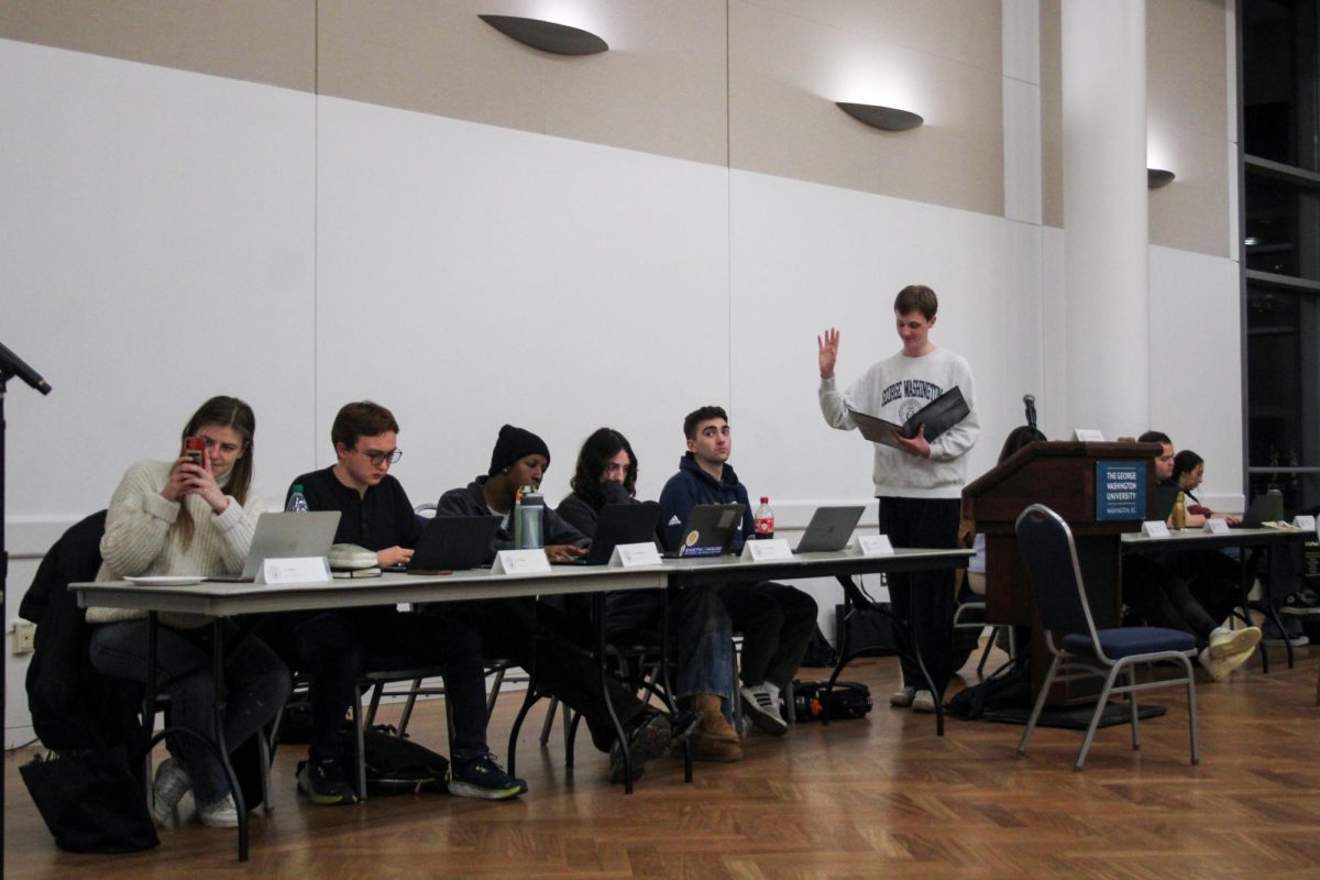 Student Government Association Vice President Ethan Lynne conducts the swearing in process for new Legislative Budget Office positions.