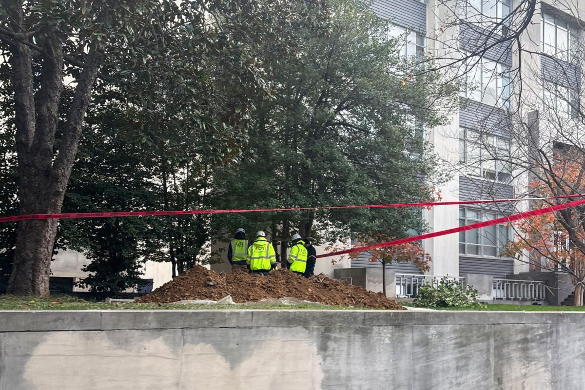 Workers attempt to repair the water main break outside of Tompkins Hall.