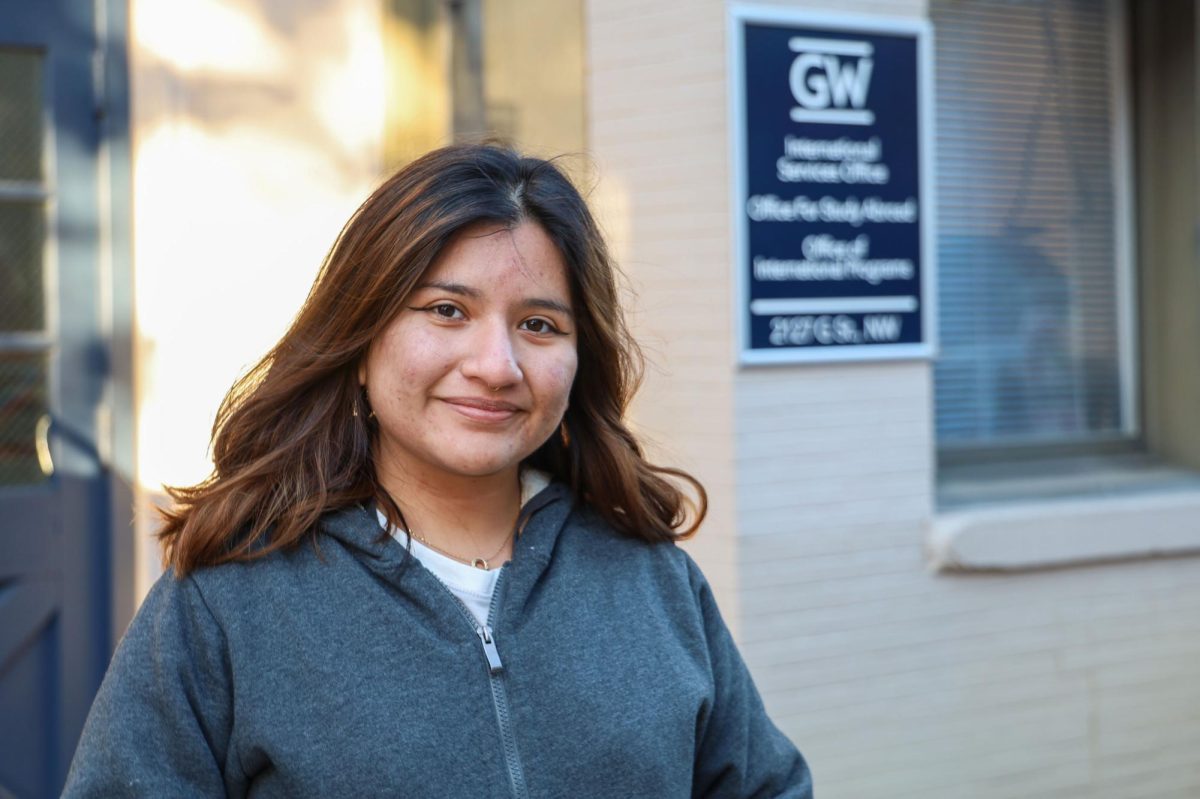 Sophomore Paola Sigüenza poses for a portrait in front of the International Students Office.