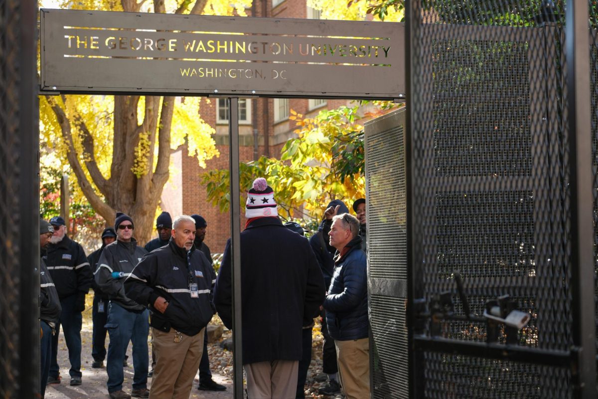 A representative of Dominion Defense Systems, the contractor for the new fencing, helps to familiarize members of the Facilities Maintenance department with the new structure.