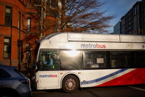 A Metrobus passes through Washington Circle.