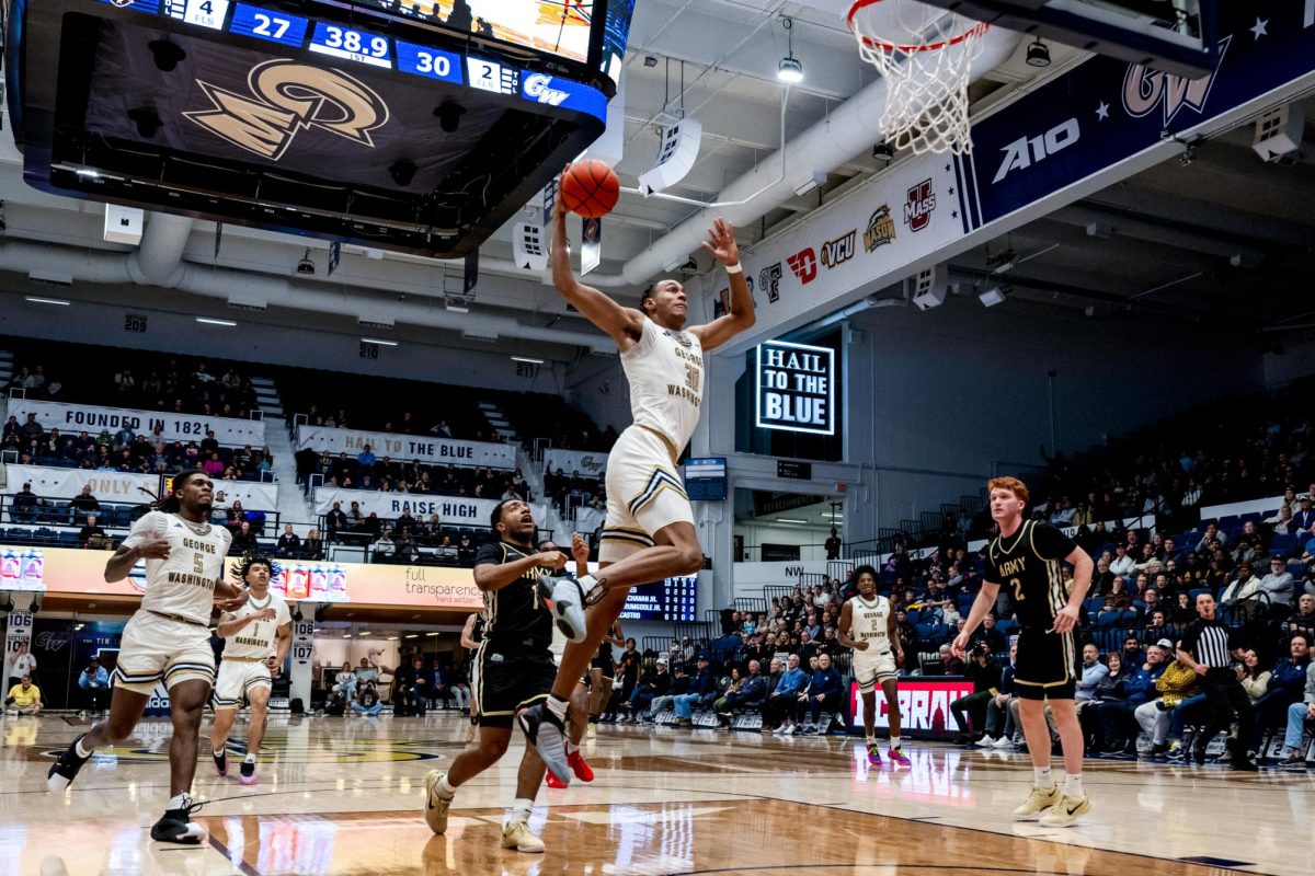 Redshirt junior forward Rafael Castro shoots a basket during tonight's game against Army.