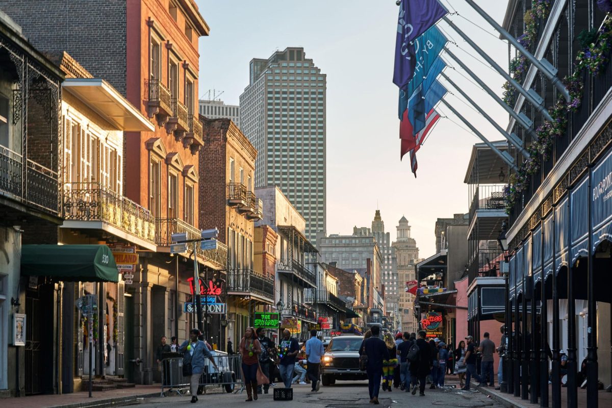 Pedestrians walk down Bourbon Street in New Orleans in 2018.