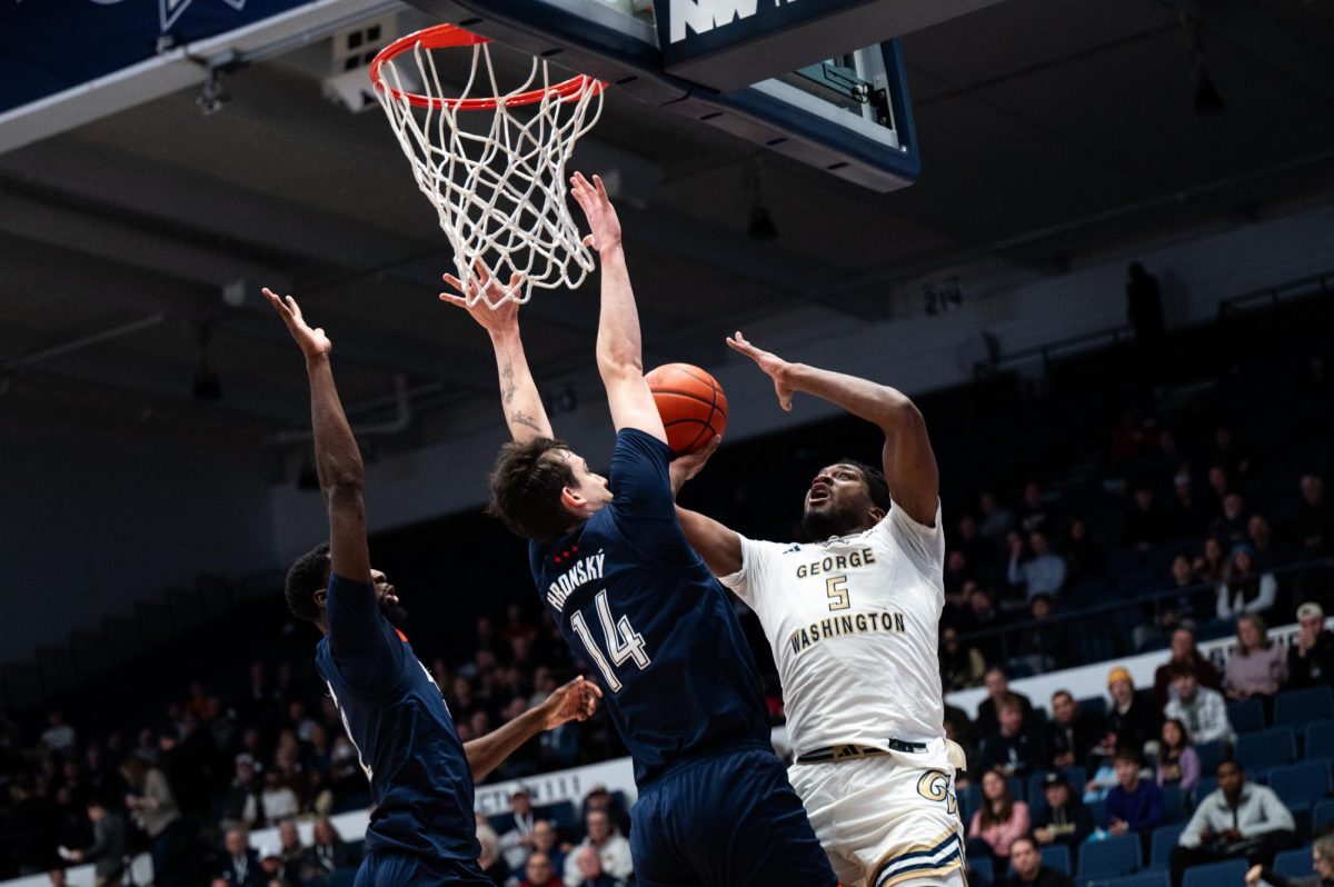 Graduate guard Gerald Drumgoole Jr. attempts to shoot a basket against Duquesne during tonights game. 