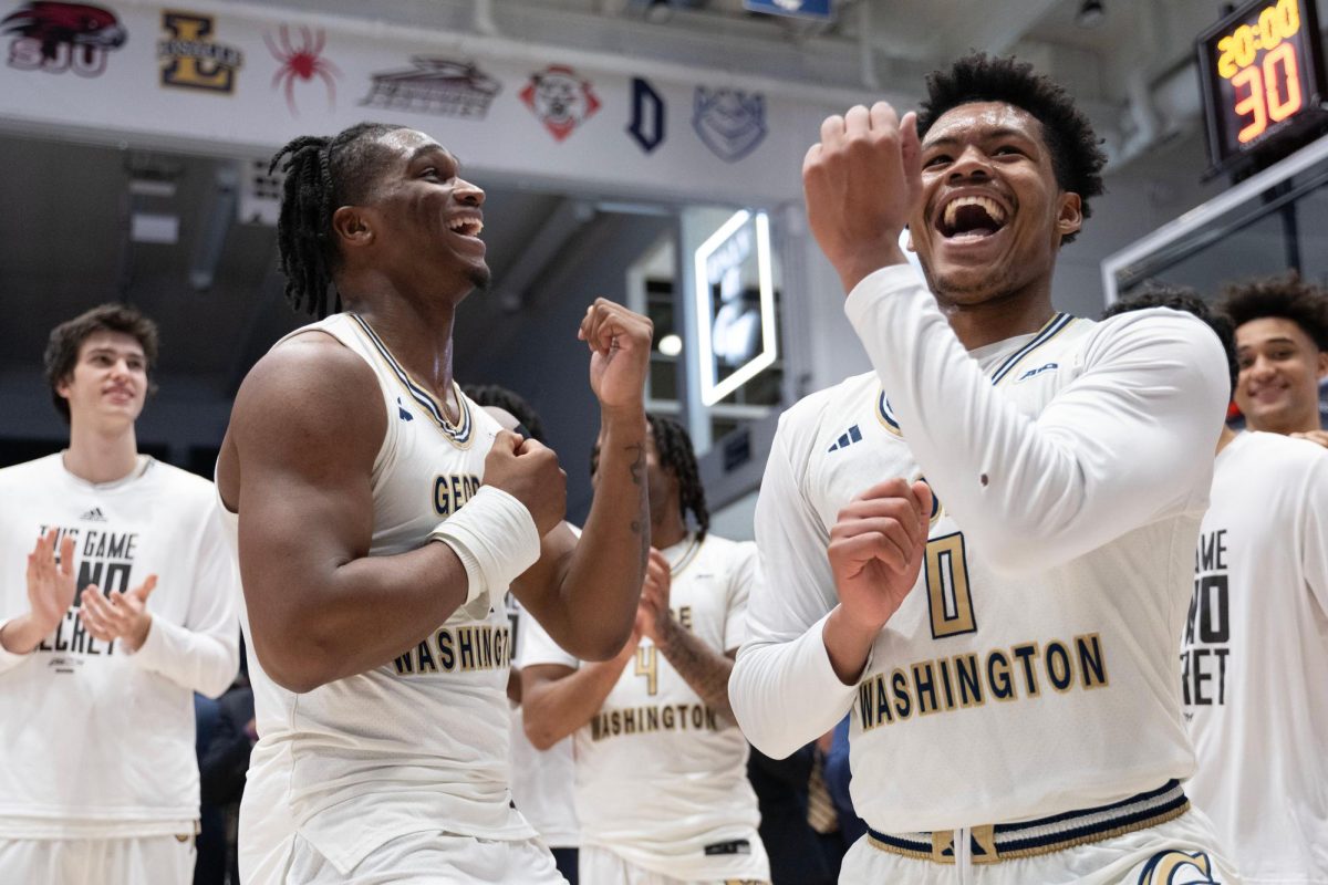 Redshirt sophomore forward Darren Buchanan Jr. celebrates alongside sophomore guard Trey Autry after their win against Richmond. 