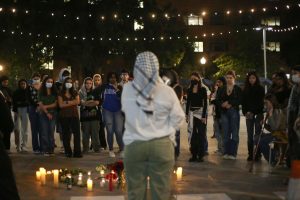 A student wearing a keffiyeh speaks during a vigil for Marcellus Williams co-hosted by Black Defiance in October.