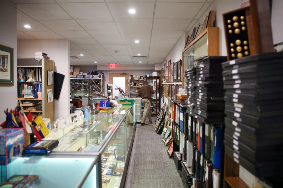 A man walks through Nelson Whitman's store.