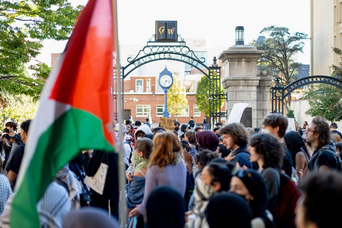 Members of GWU Students for Justice in Palestine participate in a walk out in Kogan Plaza in October.