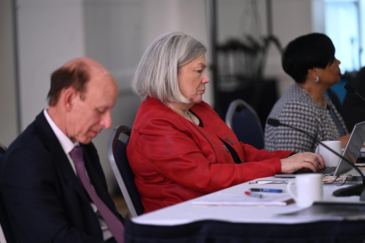 University President Ellen Granberg sits beside trustees at the Board of Trustees' February meeting.