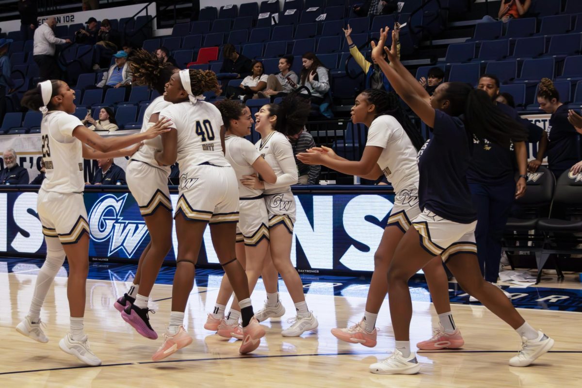 The women's basketball team celebrates a win earlier this season.