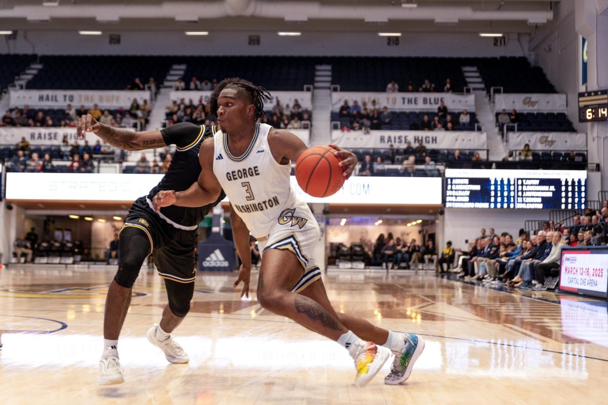 Redshirt sophomore forward Darren Buchanan Jr. moves the ball down the court during a game last week.