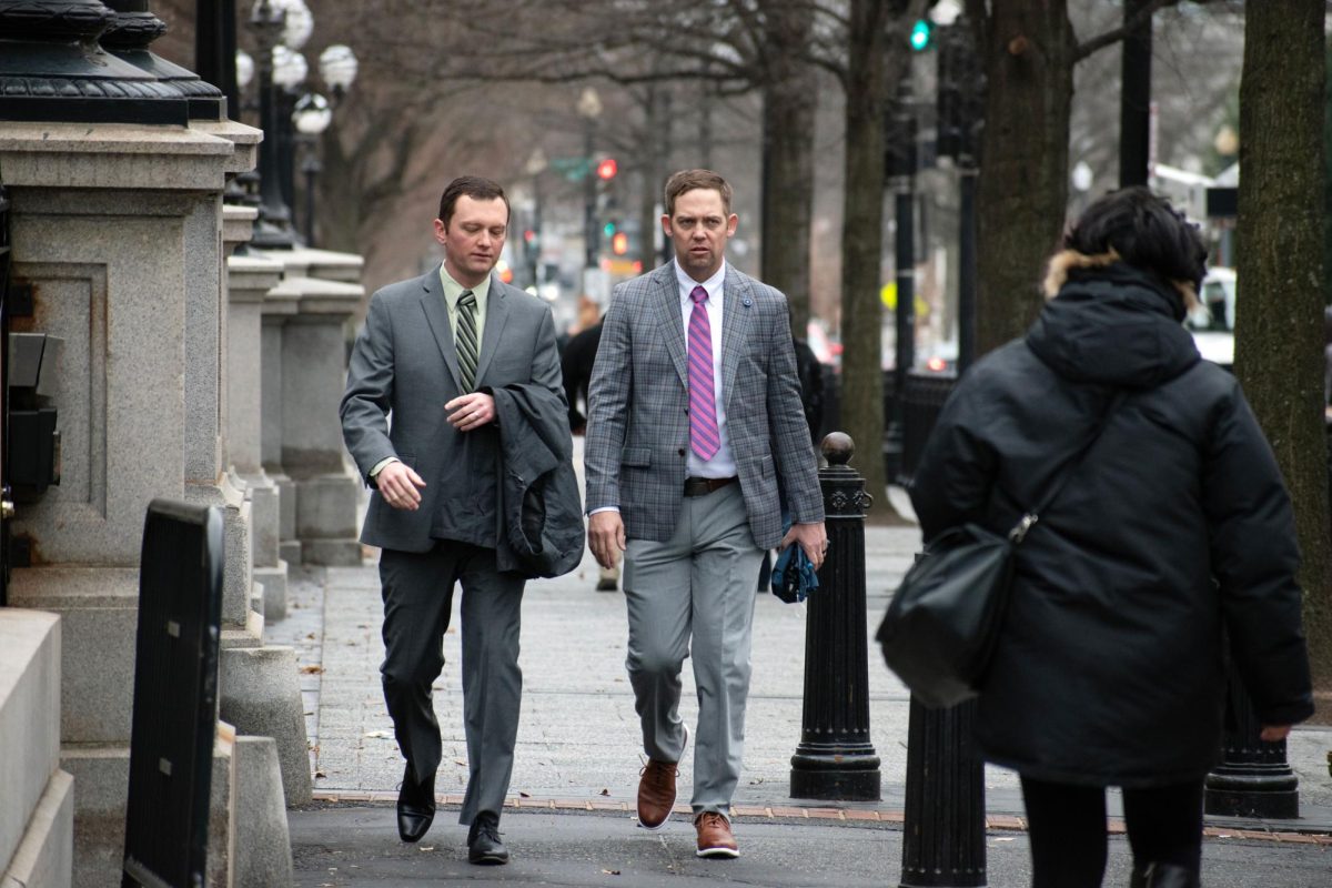 Two men walk down 17th Street after work.