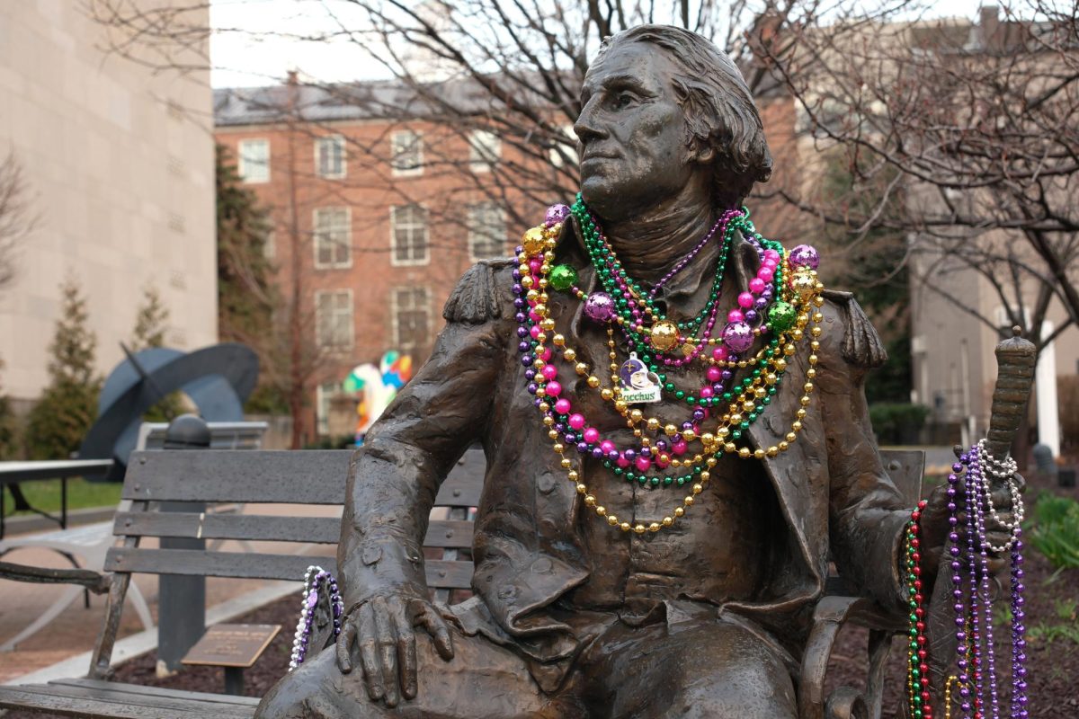 The "George Washington Bench" statue in Kogan Plaza is adorned with Mardi Gras beads.