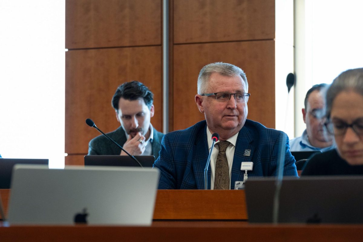 Medical Faculty Associates CEO Bill Elliott speaks during the Faculty Senate meeting.