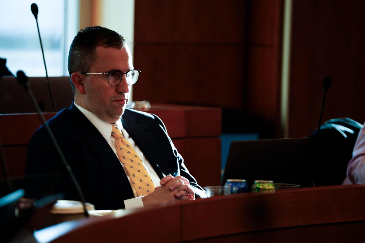 Chief Financial Officer Bruno Fernandes listens during a Faculty Senate meeting in November.