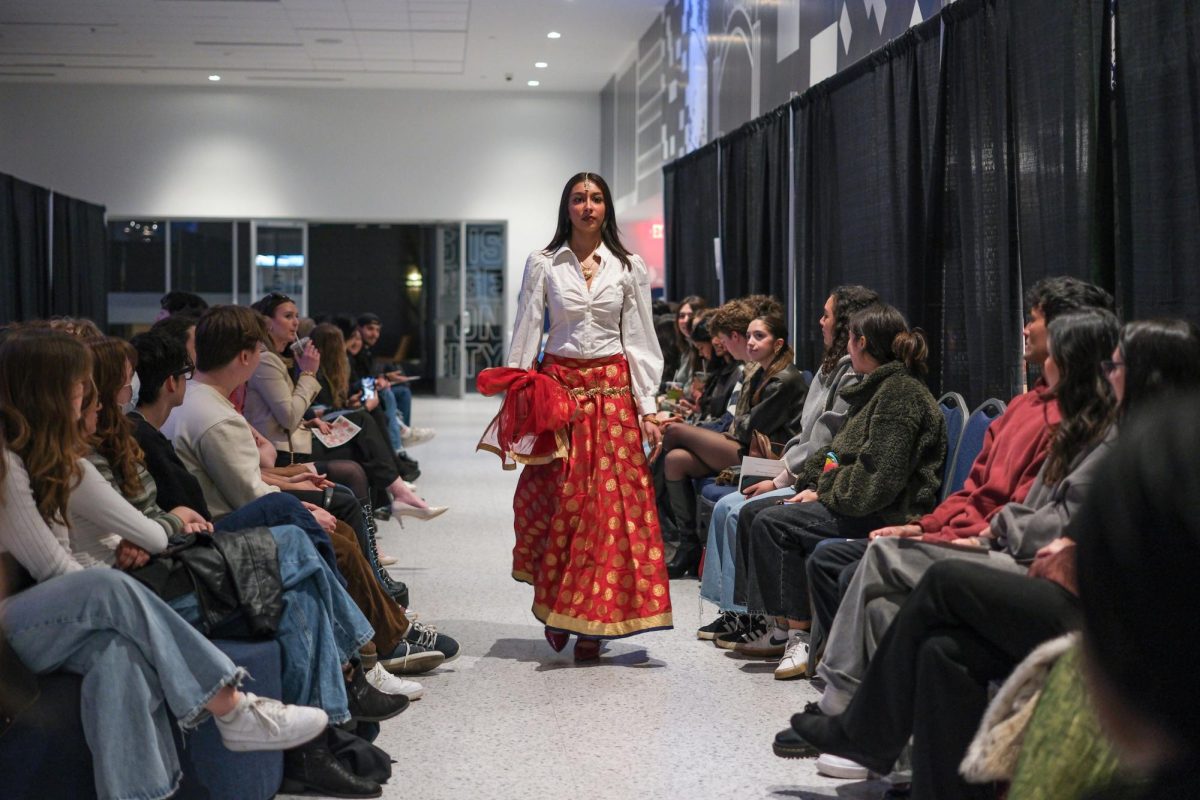 Sophomore Amari Sharma walks in the South Asian Fashion Show.