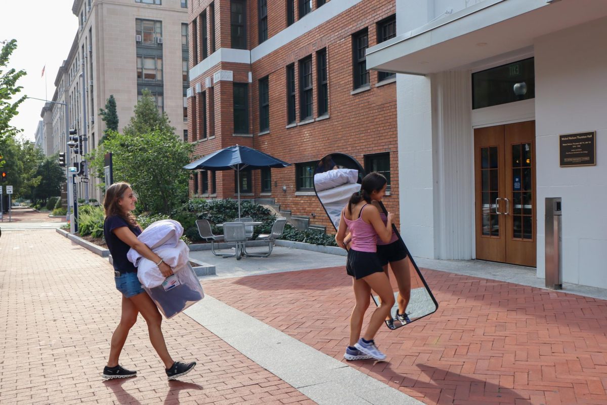 A first-year student moves into Thurston Hall Sunday. 