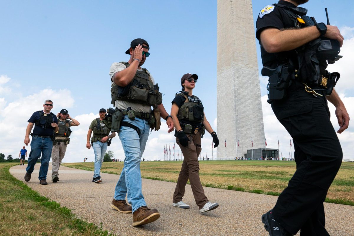 Federal agents patrol the National Mall on Saturday.