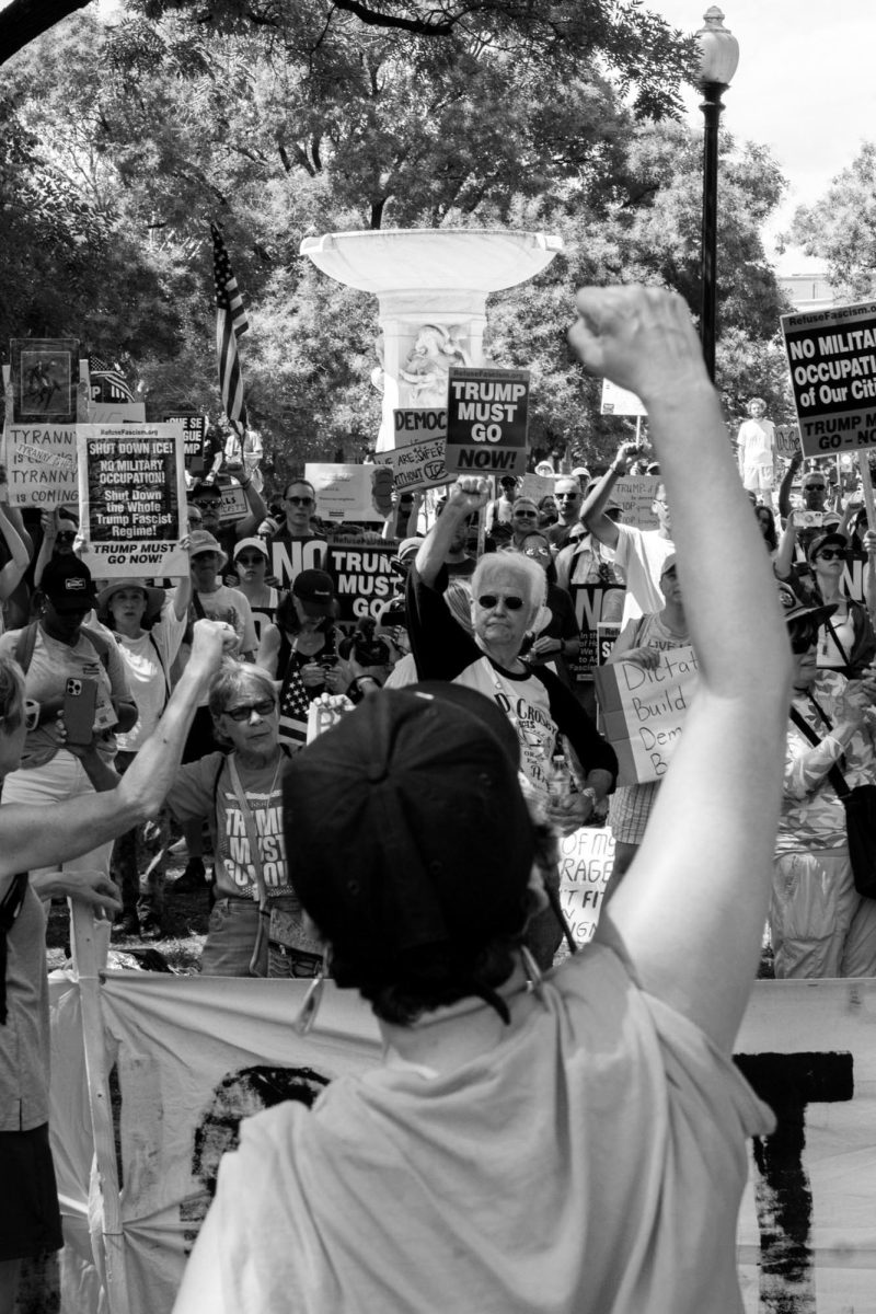 Sam Goldman raises her fist during a anti-Trump rally at DuPont Circle in Washington on Saturday.