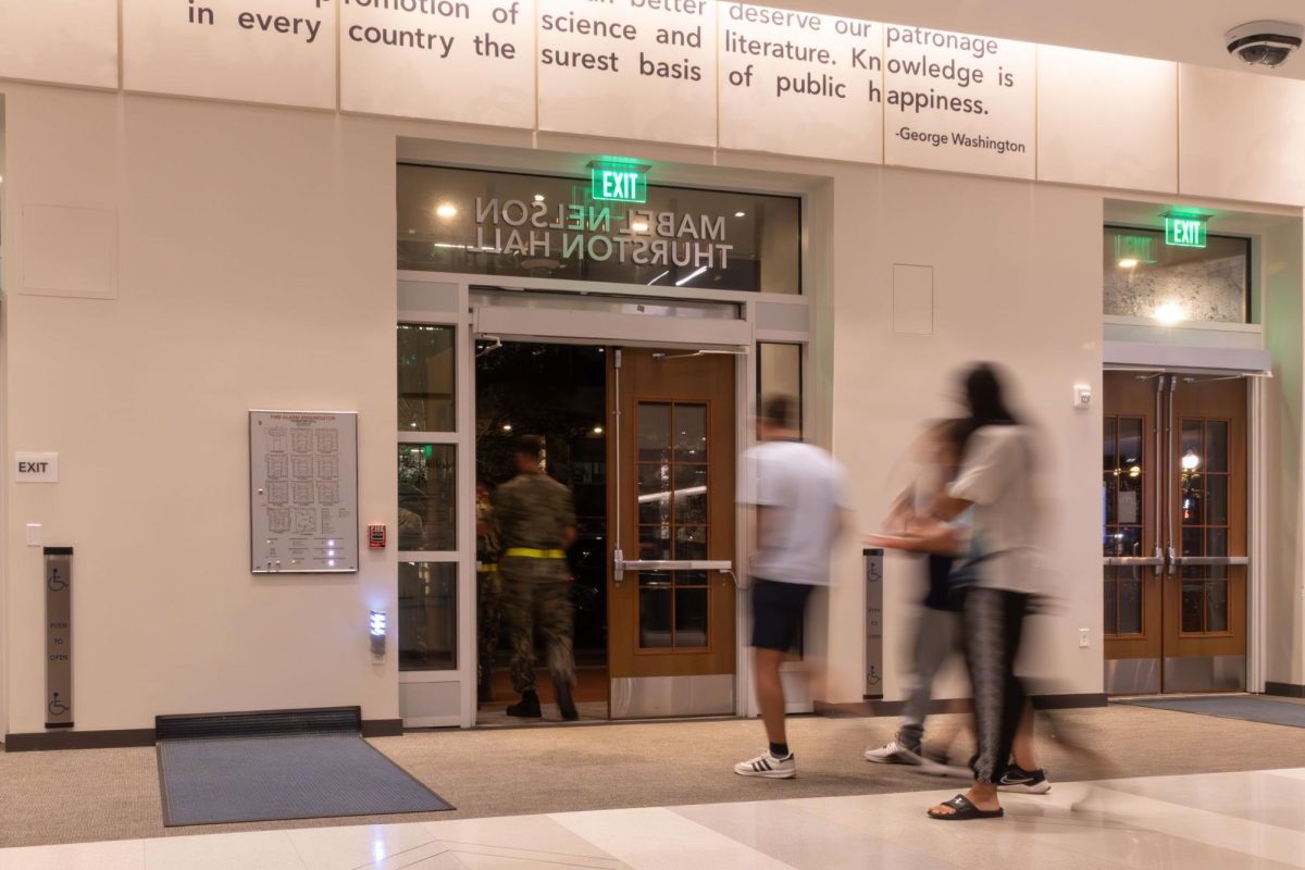 Students exit Thurston Hall late Saturday night.