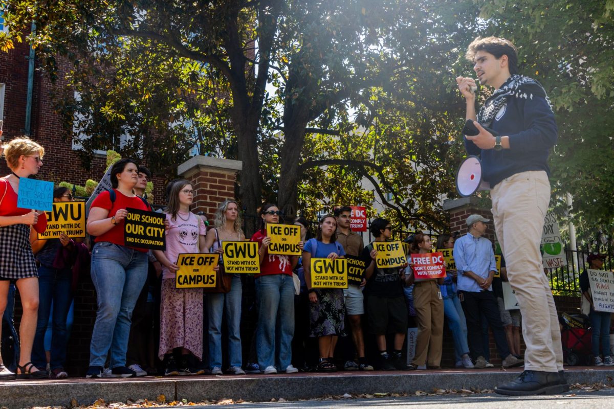 Students gather around University President Granberg's F Street House during a walkout on Tuesday.