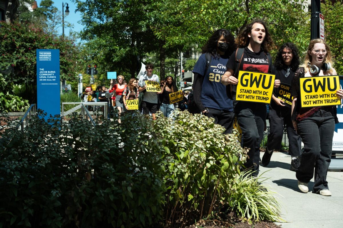 About 40 students and community members gathered in Potomac Square Tuesday afternoon to protest President Donald Trump’s deployment of the National Guard in D.C. during a walkout campaign across four universities in the District.