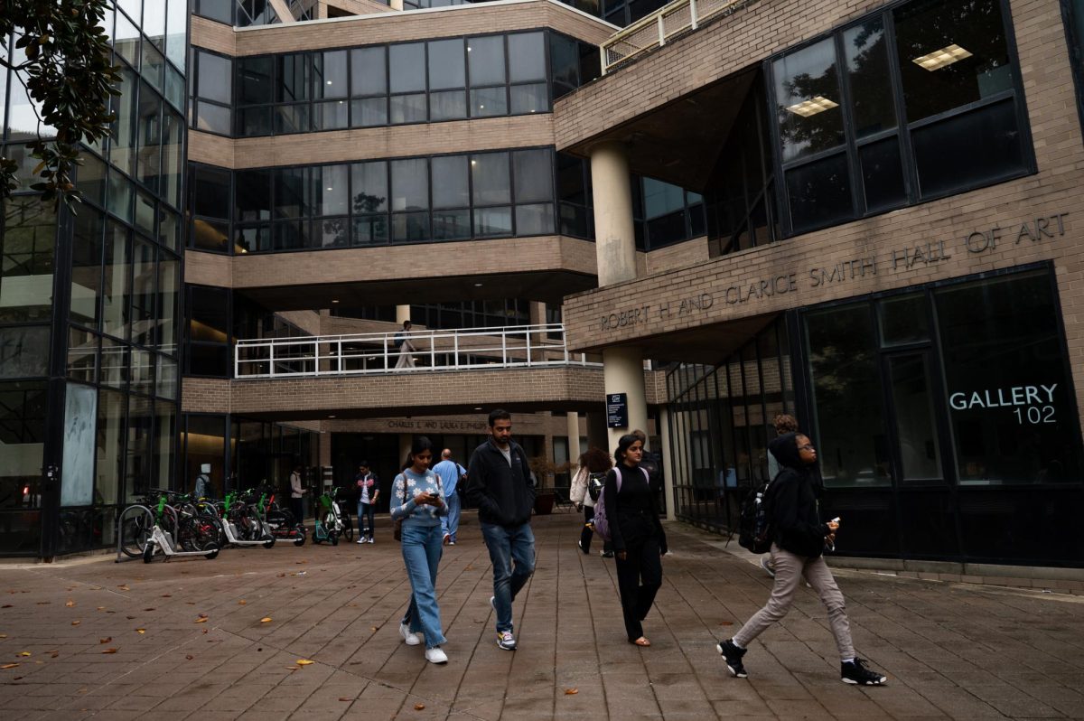 Students walk through the breezeway between Rome and Smith halls.
