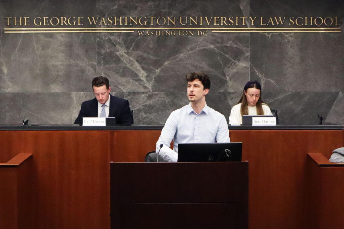 Student Bar Association Senator Thaddaeus Canuel speaks at a SBA meeting on Tuesday.
