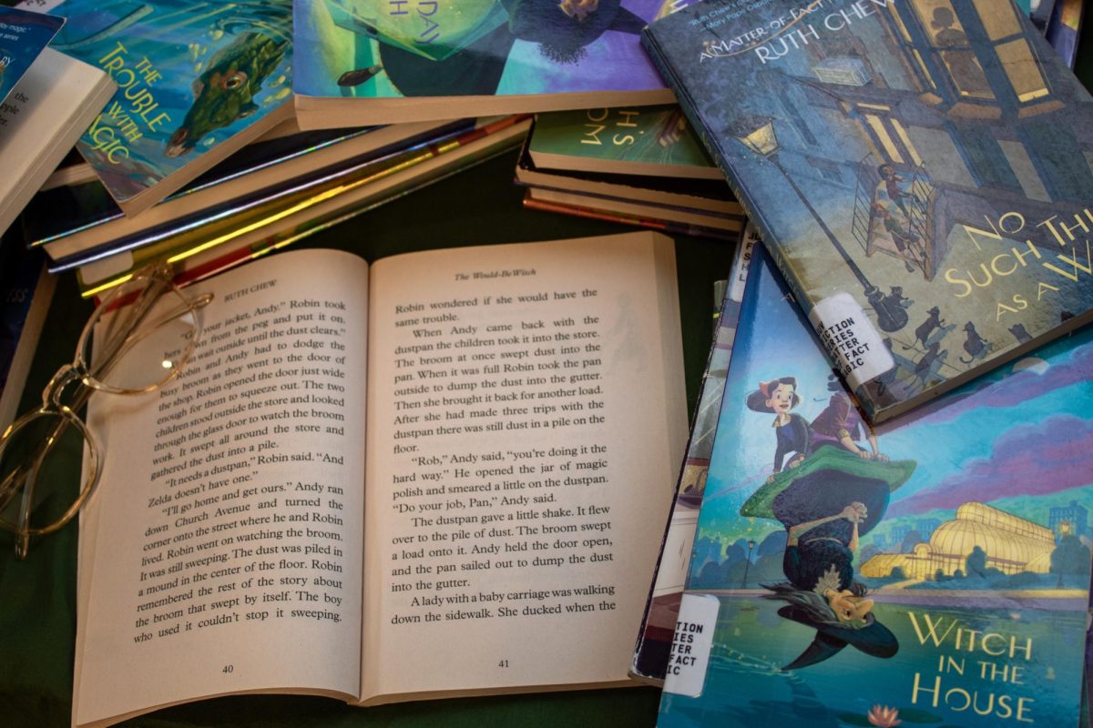 Books from the Matter-of-Fact Magic series laid out on a table.