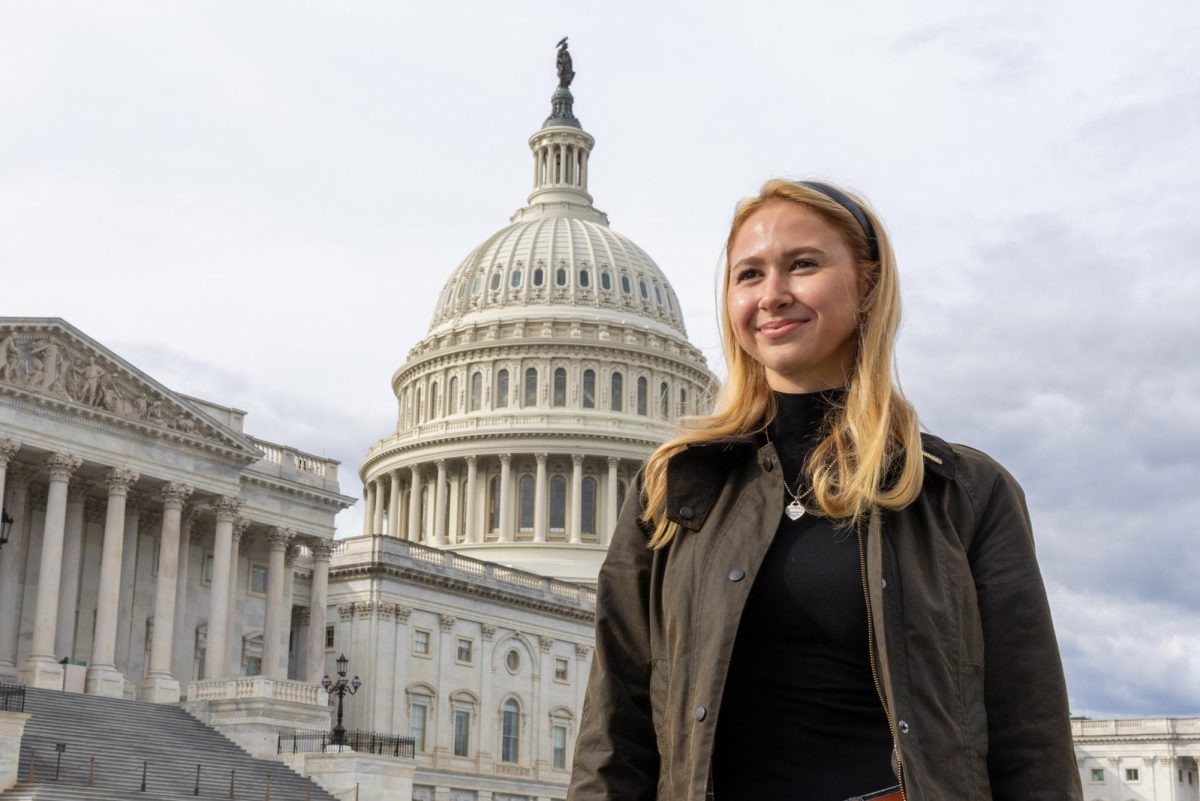 Junior Ana Claire Hanley poses for a portrait in front of the U.S. Capitol.