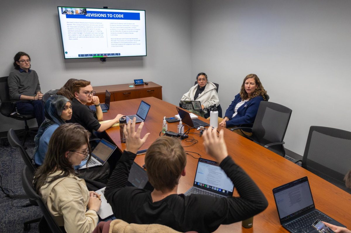 Students sit in on a meeting about the revised Code of Student Conduct.