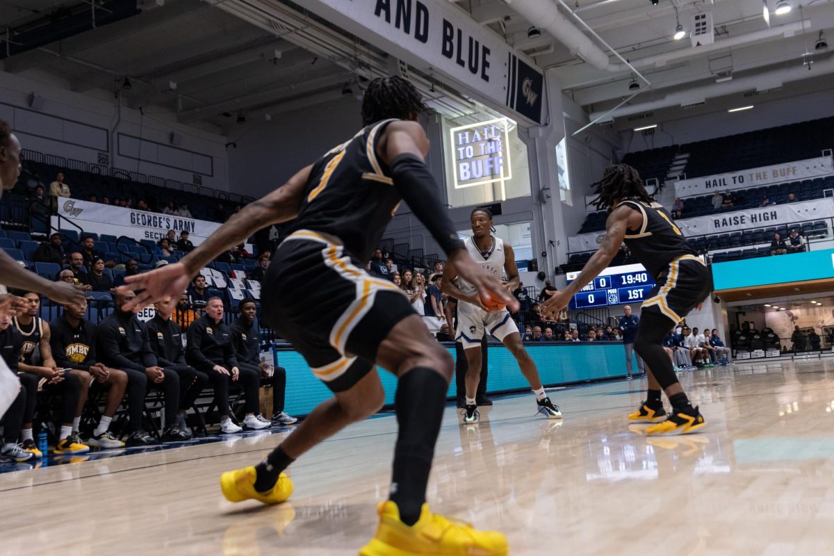 Redshirt sophomore guard Christian Jones looks to pass the ball during last week's game against the University of Maryland Baltimore County.