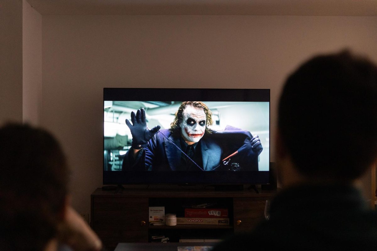 Students watch "The Dark Knight."