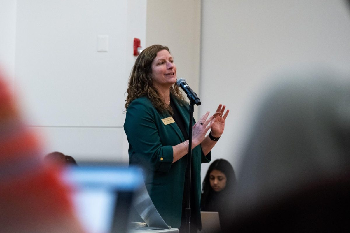 Associate Vice Provost and Deputy Dean of Students Rachael Stark presents at a SGA meeting on Monday. 
