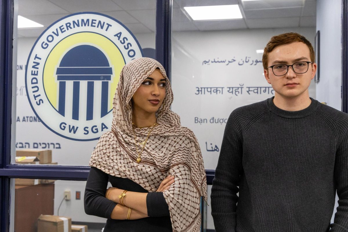 Zainab Abdi and Ben Wieser pose for a portrait.
