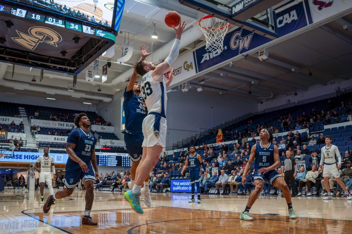 Graduate forward Luke Hunger attempts to shoot during a game against Rhode Island earlier this month.