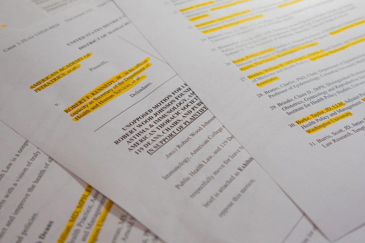 Pages of a amicus brief signed by 40 faculty members challenging CDC childhood vaccine schedule changes.