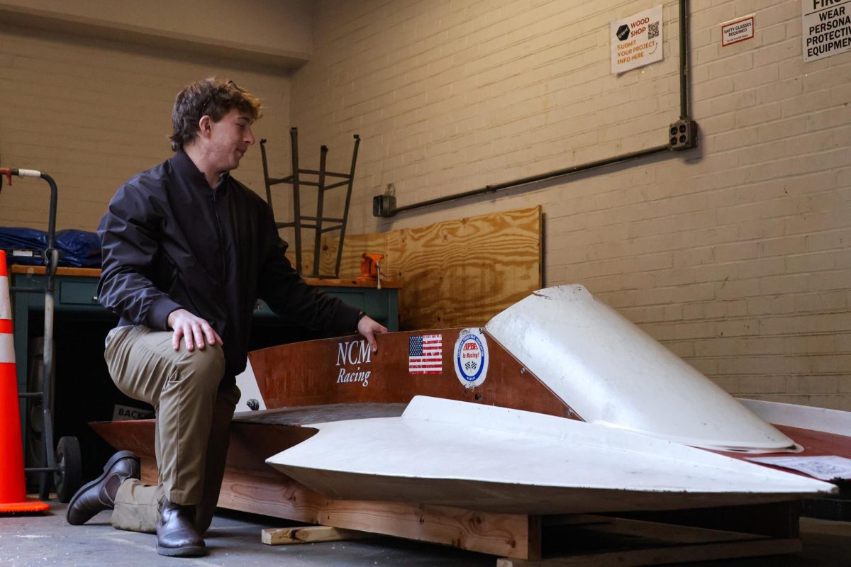 Electric Yacht Club co-founder Adam Newman show offs the boat.