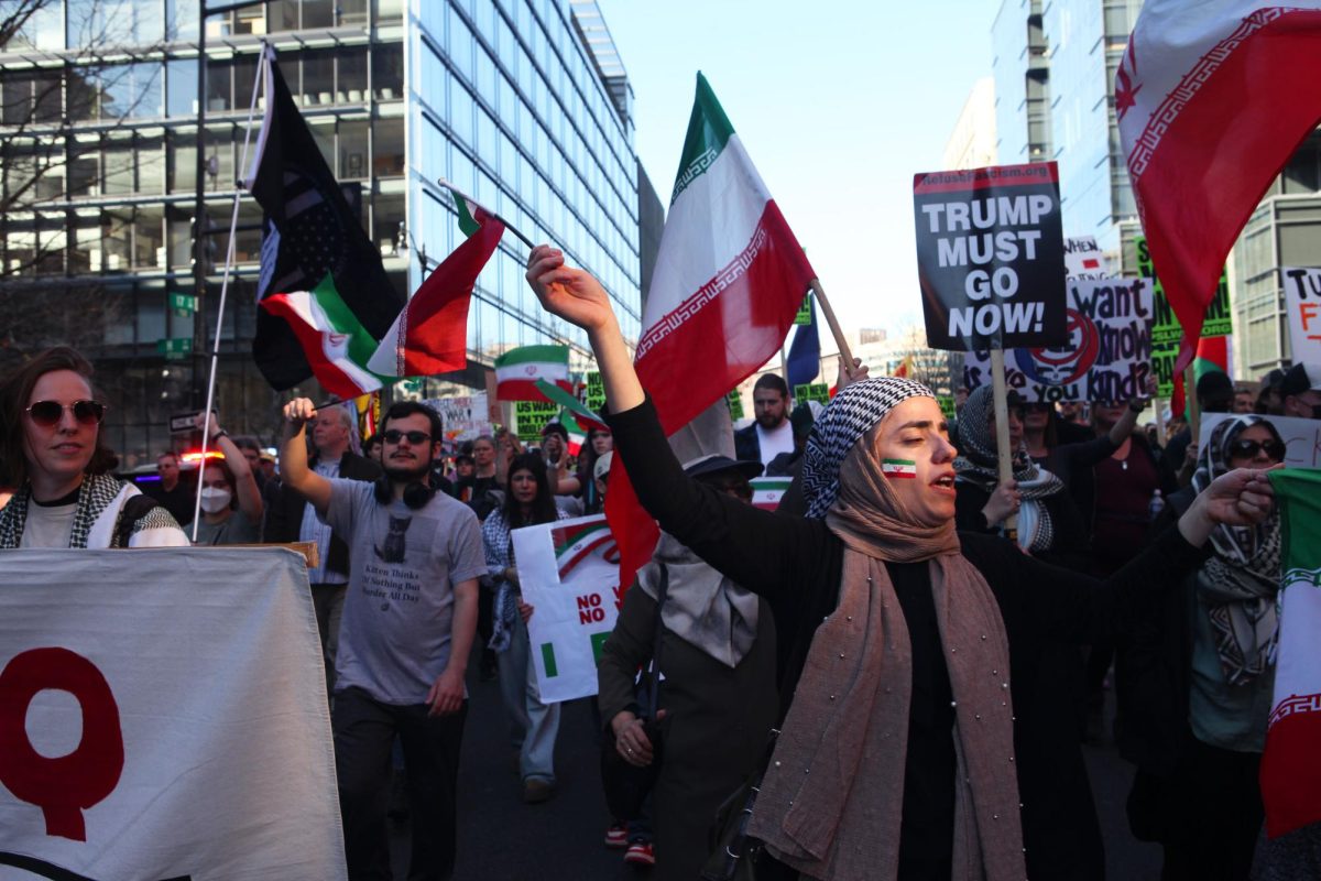 A woman marches in a protest against U.S airstrikes in Iran on Saturday. 