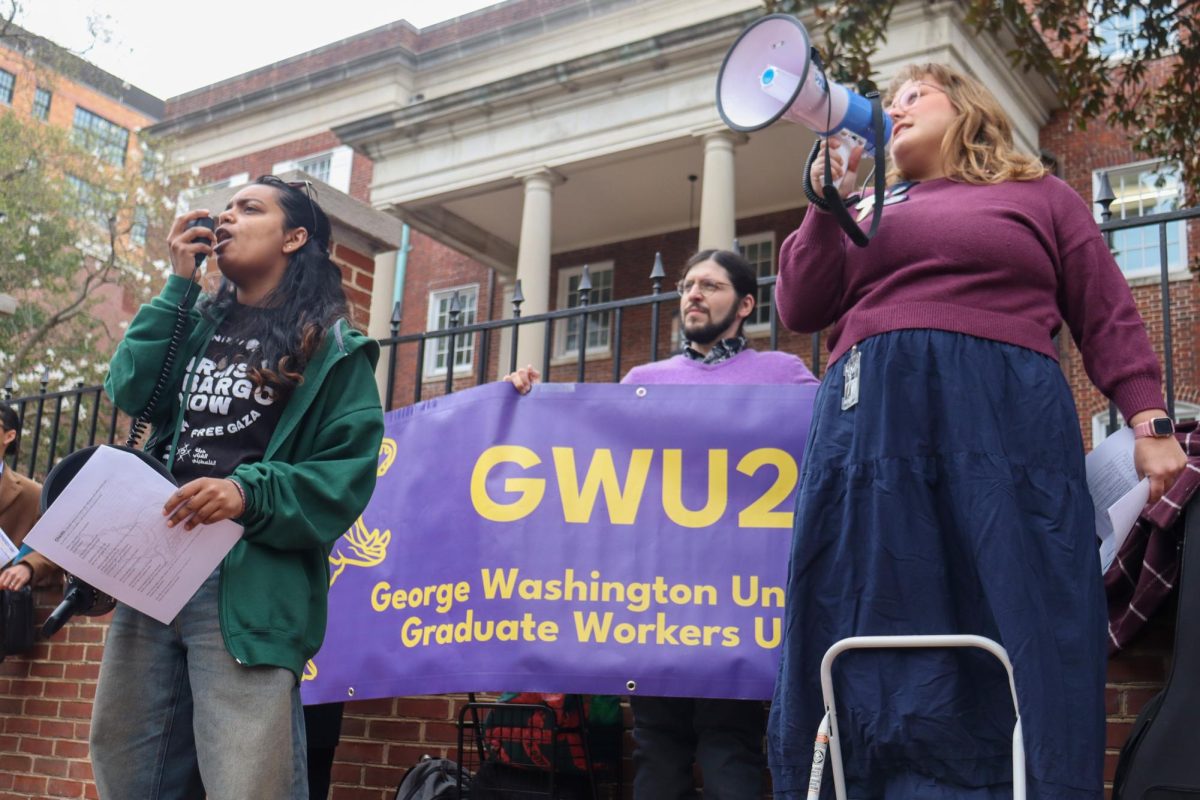 The Graduate Student Union protests outside of 1922 F St.