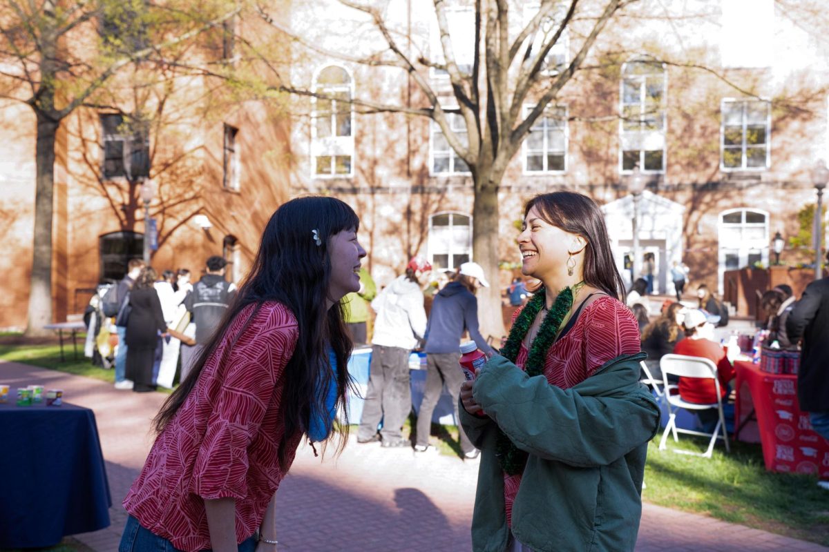 Dancers laugh during the Day for the Nations in UYard on Friday.