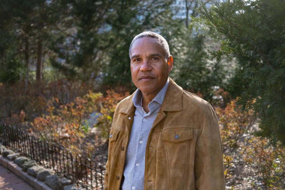 Peter Maye poses for a portrait near a community gardens on 26th and I St.