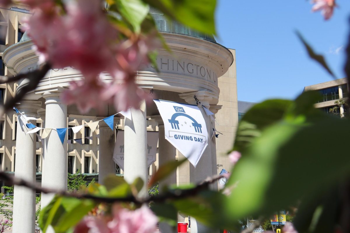 A Giving Day sign hangs on the tempietto in Kogan Plaza.