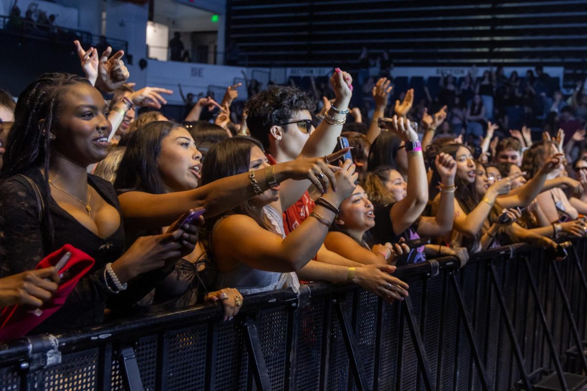 Students dance to Spring Fling headliner Flo Milli at the Smith Center on Saturday.