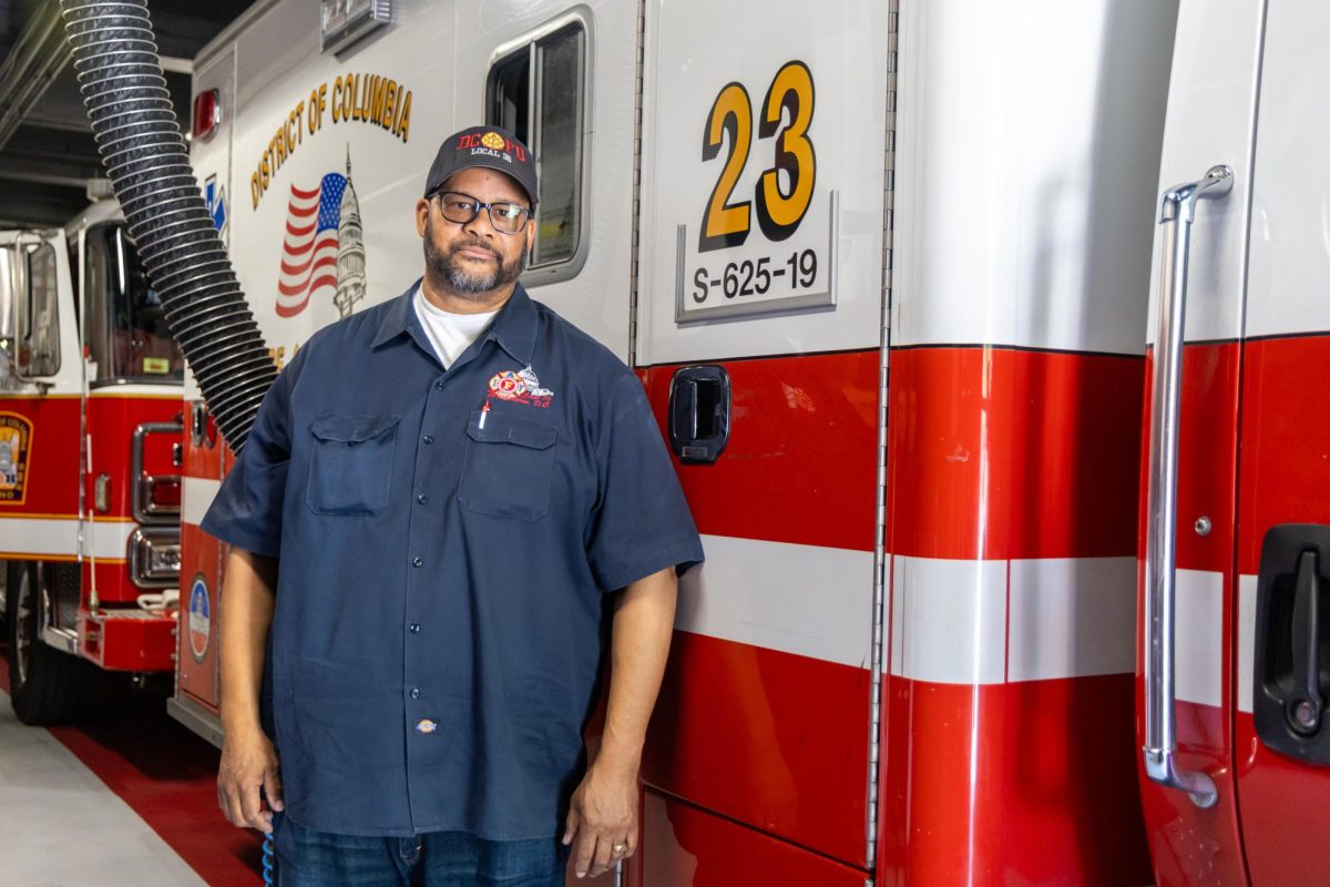 Retired D.C. Firefighter Joe Chisholm poses for a portrait at the Engine 23 Fire Station. 
