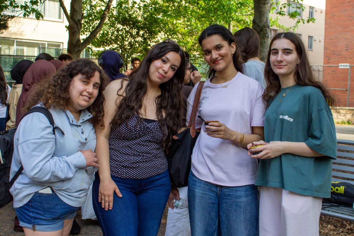 Attendees of the Arab Student Association cookout pose for a portrait in Anniversary Park. 